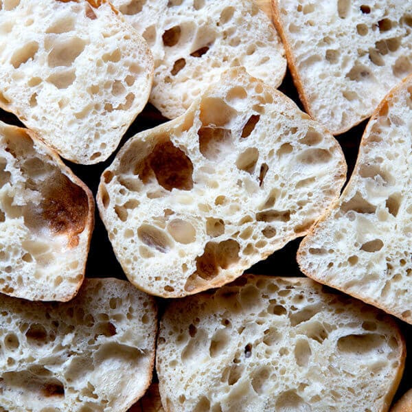 A pile of halved ciabatta rolls.