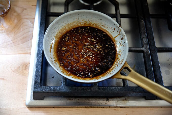 Reduced balsamic in a skillet.