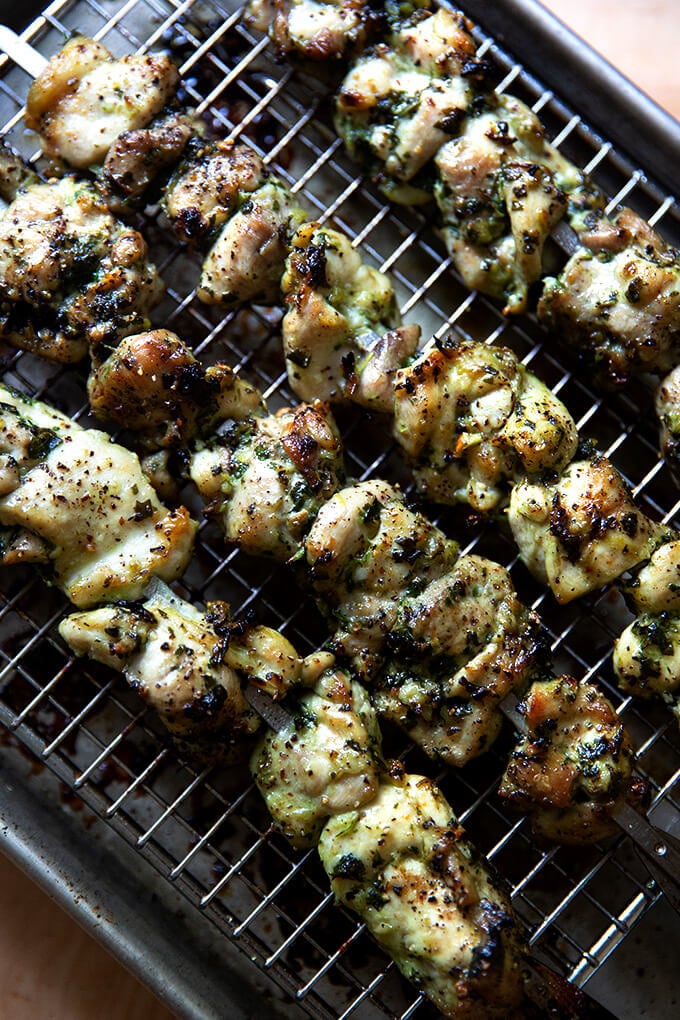 Broiled chicken souvlaki on a sheet pan.