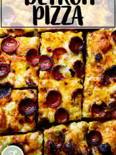 A sliced pepperoni Detroit-style pizza on a board.