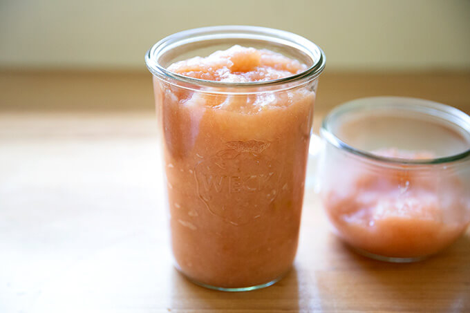 Weck jars holding homemade applesauce.