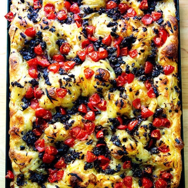 A large sheet pan holding just baked pissaladière.