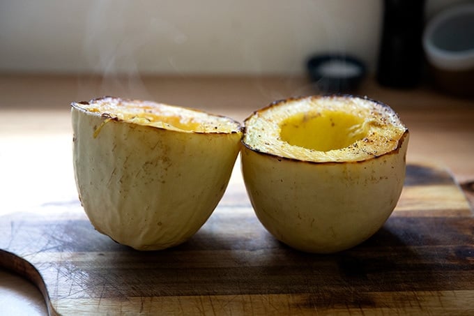 Roasted halved spaghetti squash.