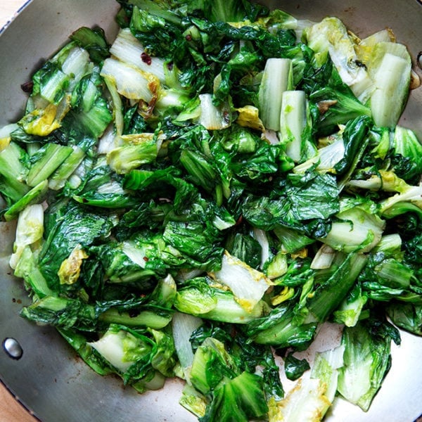 Sautéed escarole in a large skillet.