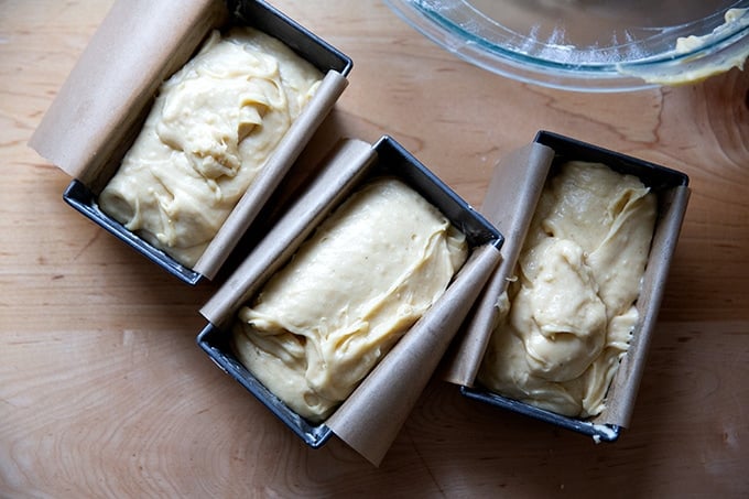 Three unbaked pans of pound cake ready for the oven.