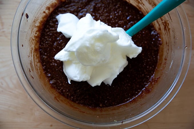 A bowl of torta caprese batter with beaten egg whites not folded in.