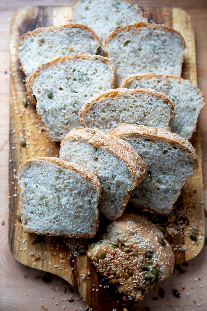 Sliced 3-seed bread on a cutting board.