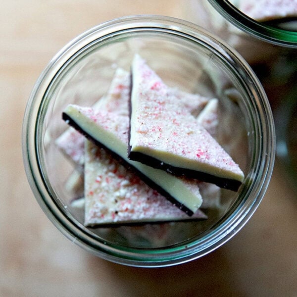 Overhead shot of peppermint bark in glass jars.