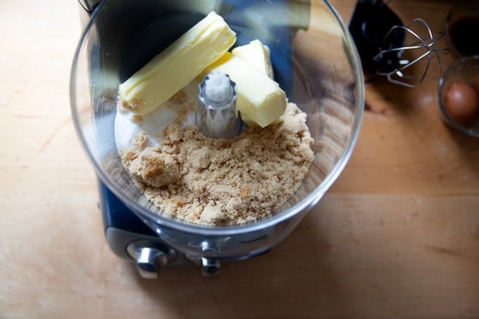 An Ankarsrum mixer filled with softened butter, sugar, and brown sugar.