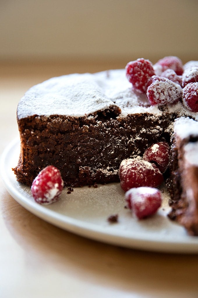 A cut Torta Caprese on a platter.