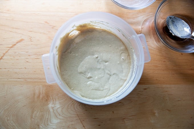 A 2-quart container holding sourdough starter.