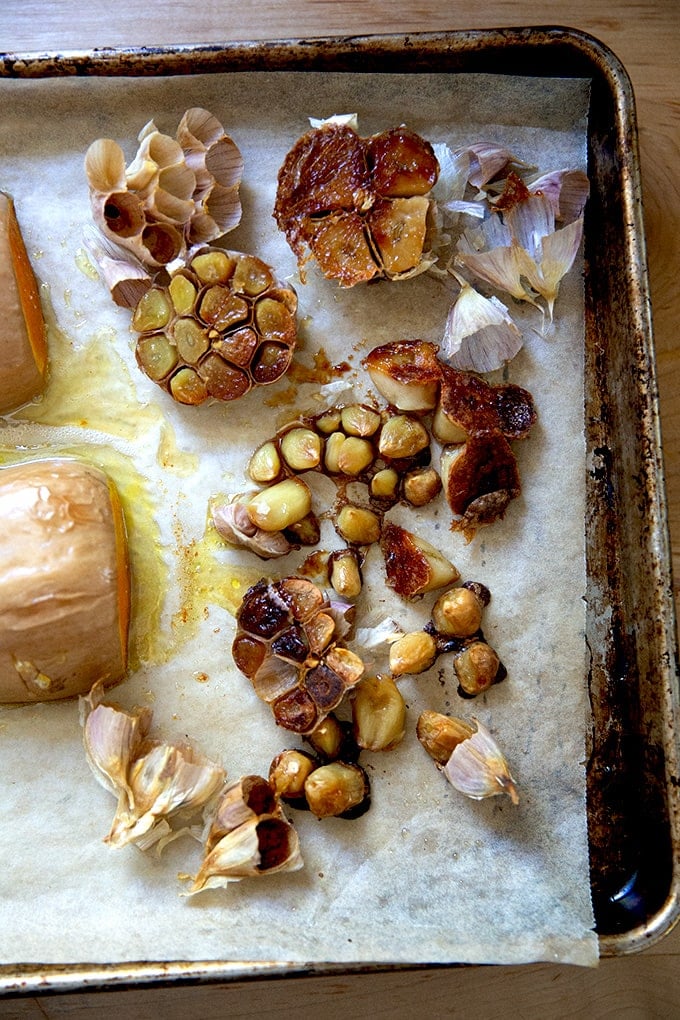 Roasted garlic on a sheet pan.