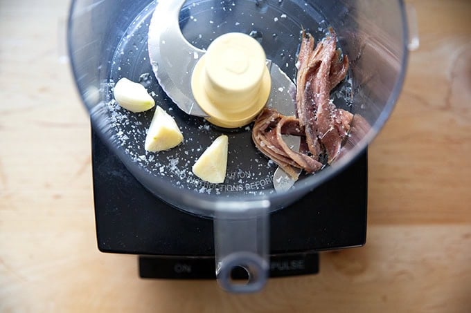 Garlic, salt, and anchovies in a food processor.