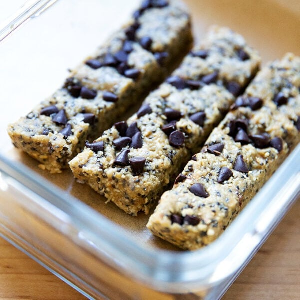 No-bake granola bars in a storage vessel.