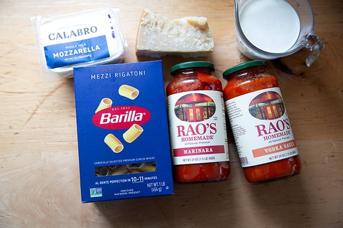 The ingredients to make baked pasta on a countertop.