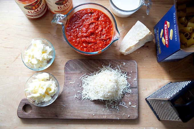 The ingredients to make baked pasta on a countertop.