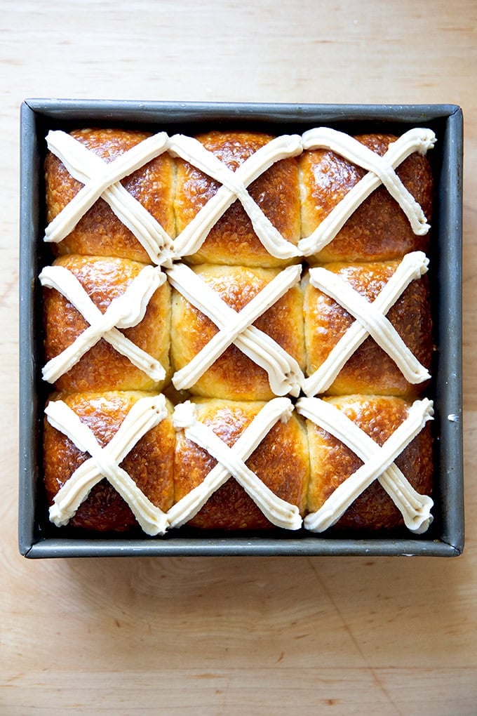 A pan of nine hot cross buns.