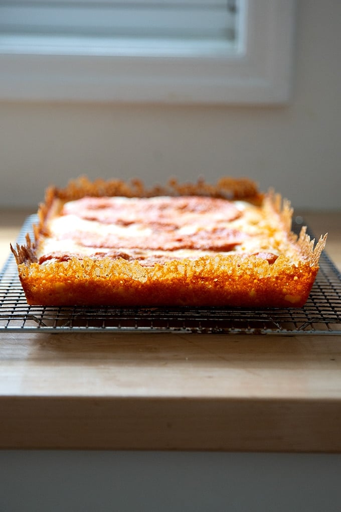 Just baked Detroit-style pizza with a lacy, frico crust.
