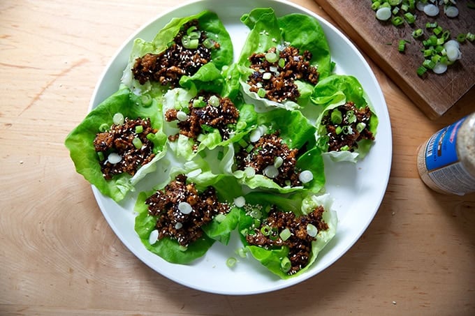 A plate of miso-lime tofu crumbles in lettuce cups.