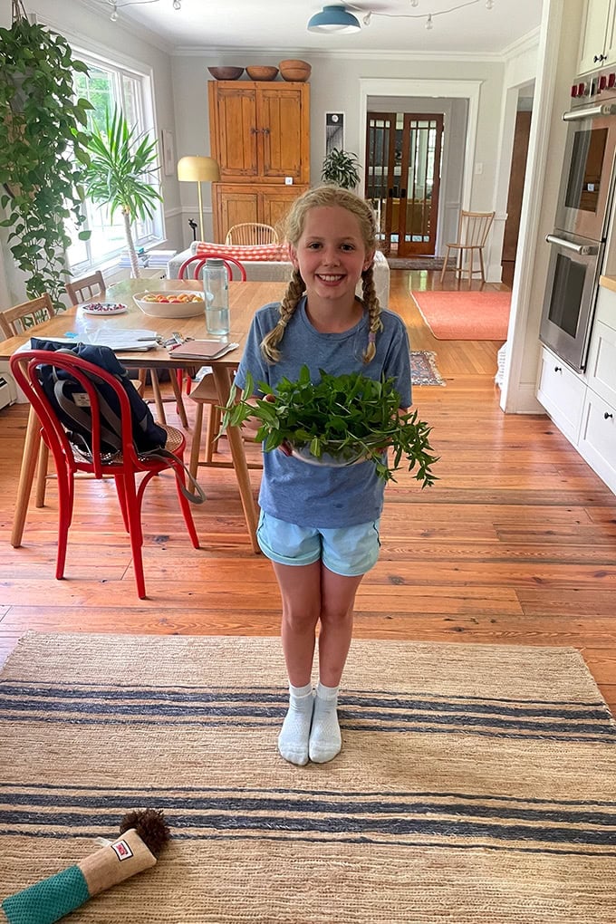 Tig, holding a bowl of mint.