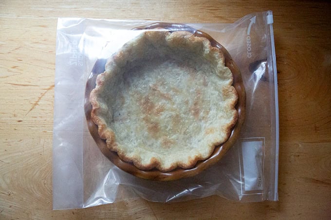 A parbaked pie crust in a ziptop bag.