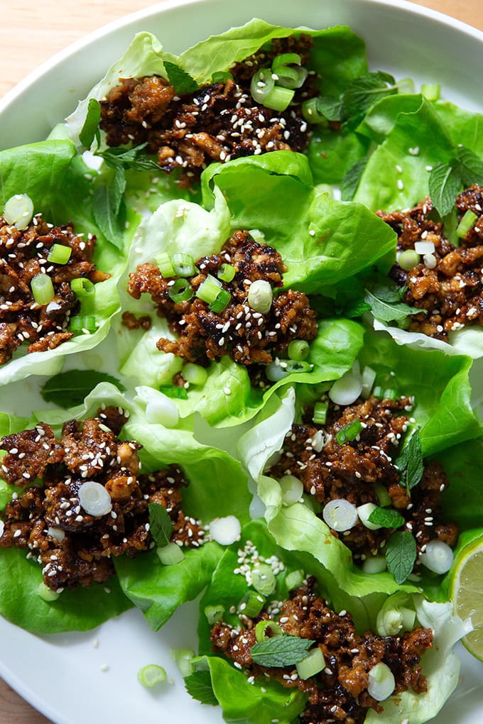 A plate of miso-lime tofu crumbles in lettuce cups.