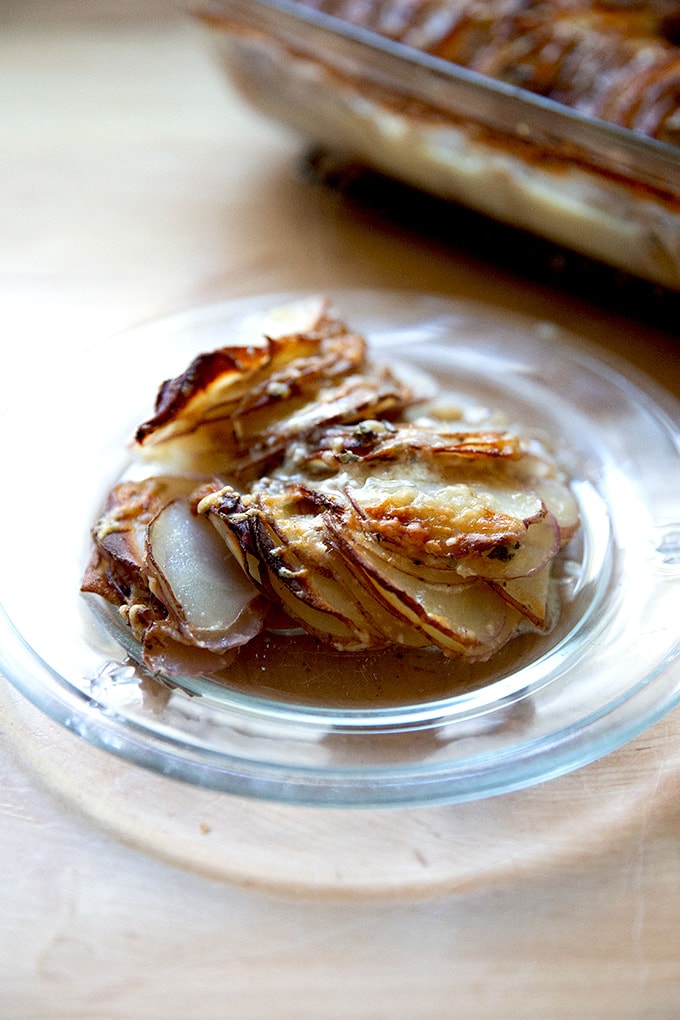 Just-baked hasselback potato gratin on a plate.