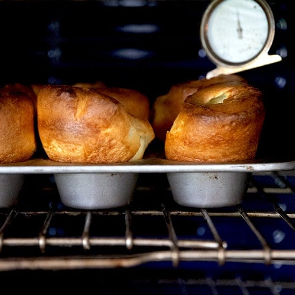 A tray of popovers in the oven.