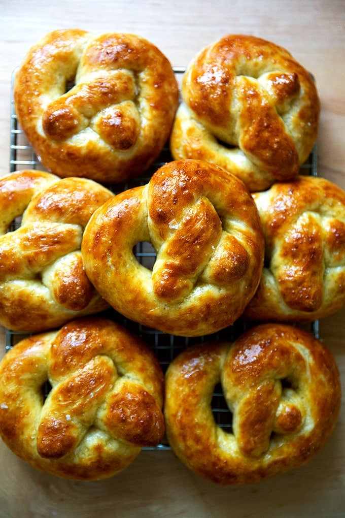 Just-baked soft pretzels on a cooling rack.