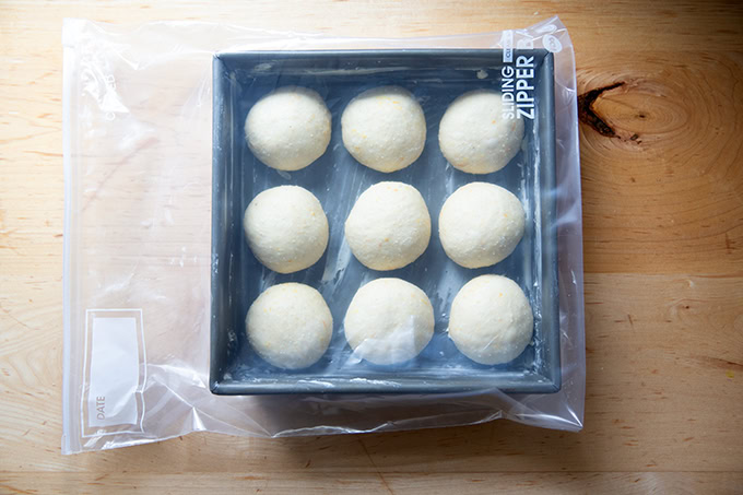A pan of hot cross buns in a ziplock bag ready to be placed in the fridge overnight.
