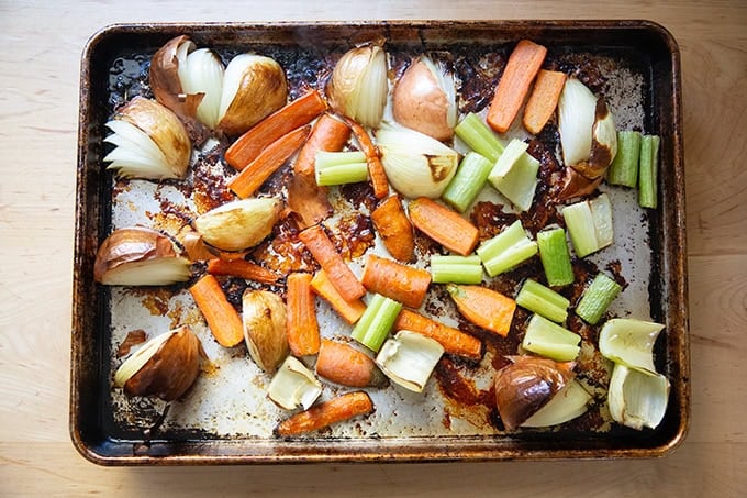 Roasted vegetables on a sheet pan.