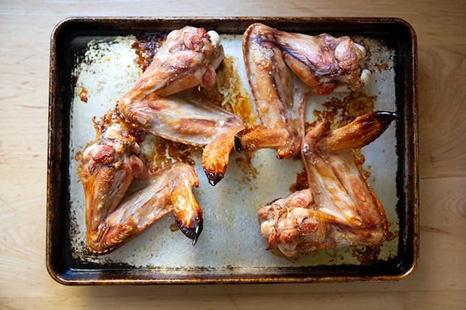 Roasted turkey wings on a sheet pan.