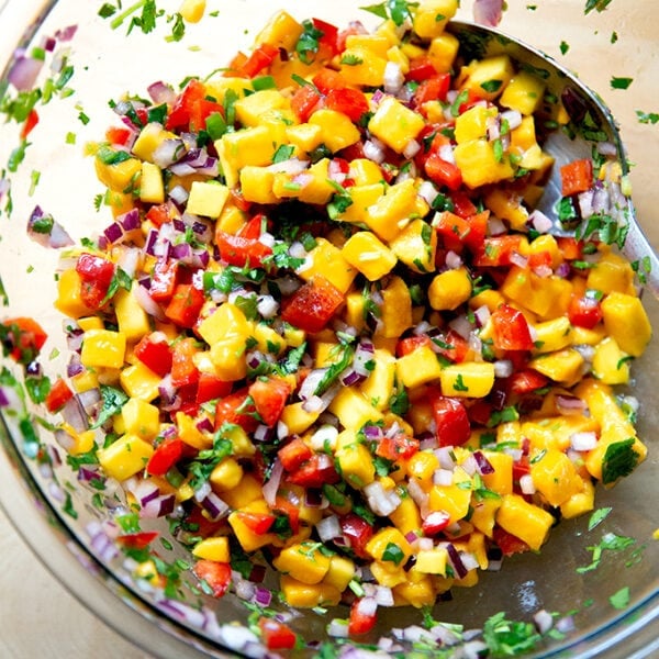 A large bowl of mango salsa.