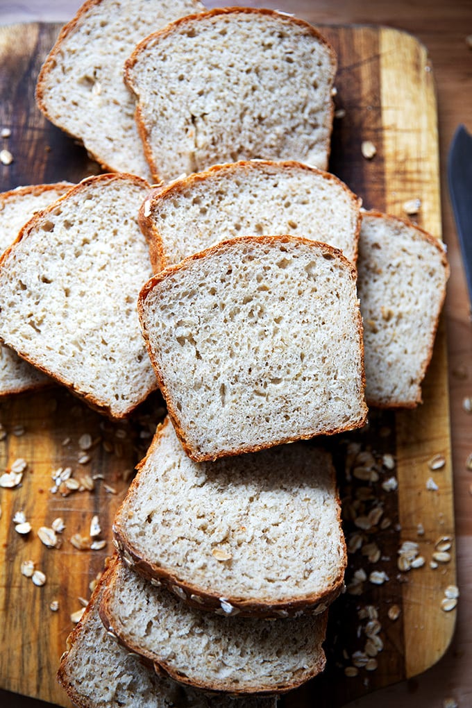A board of slices of oatmeal maple bread.