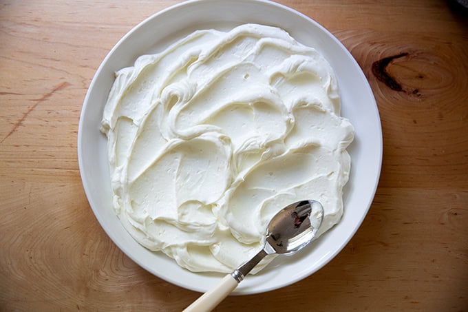 A platter spread with whipped ricotta.