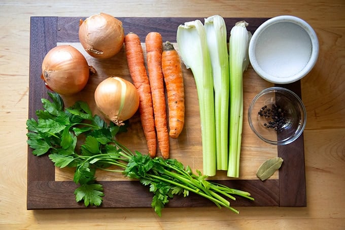 The seasonings for turkey stock: onions, carrots, celery, parsley, peppercorns, bay leaf, salt.