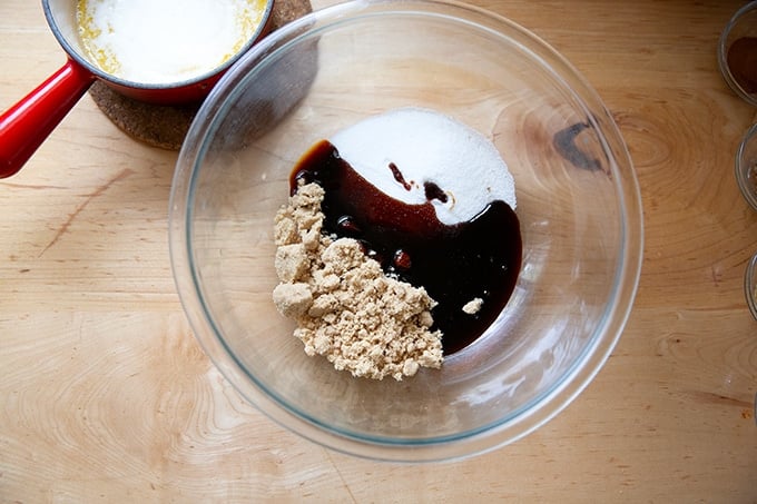 A bowl of brown sugar, white sugar, and molasses.