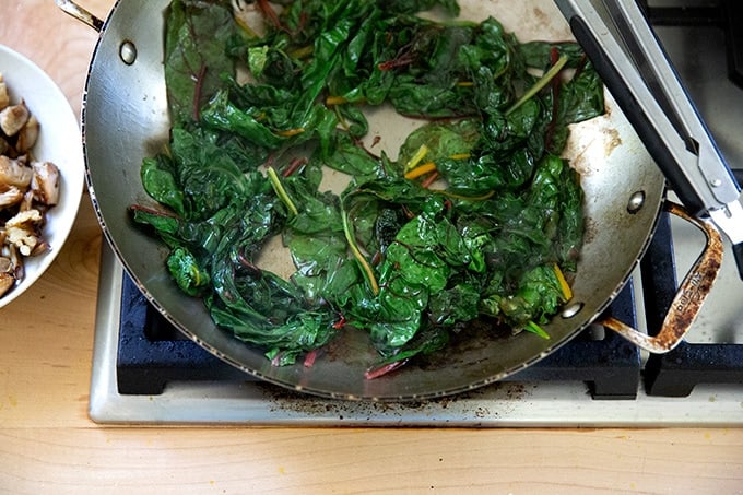Sautéed Swiss chard in a skillet.