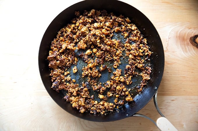 Finished tofu crumbles in a skillet.