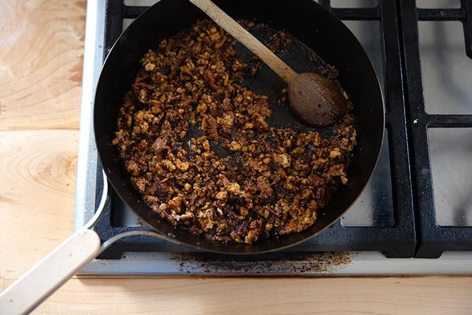 Finished miso-lime tofu crumbles in a skillet on the stovetop.