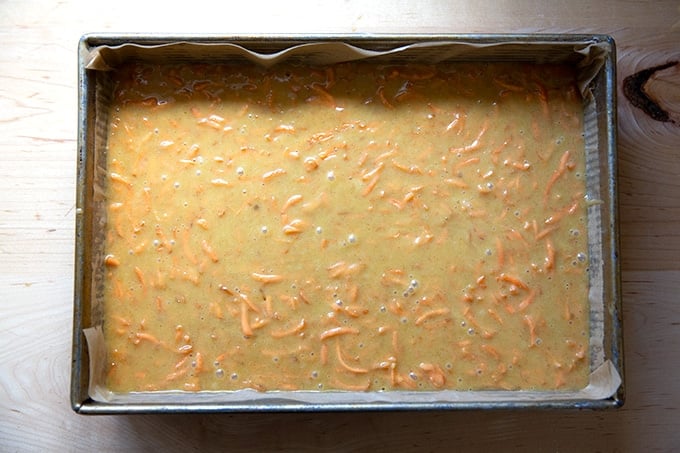 A 9x13-inch pan filled with carrot cake batter.