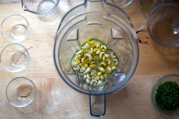 The ingredients to make vegan ranch dressing in a Vitamix.