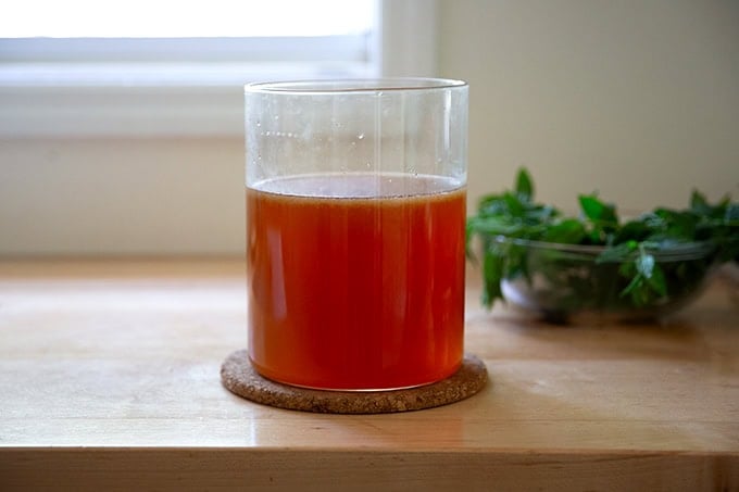 Iced tea in a large glass vessel.
