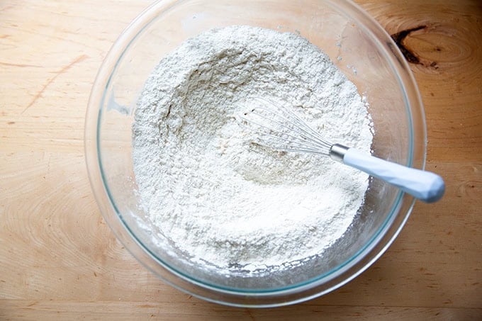 The dry ingredients to make hot cross buns whisked together.