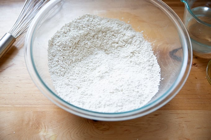 The dry ingredients to make gluten-free pizza crust whisked together in a large bowl.