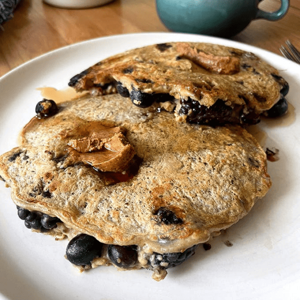High-protein pancakes with fresh berries.