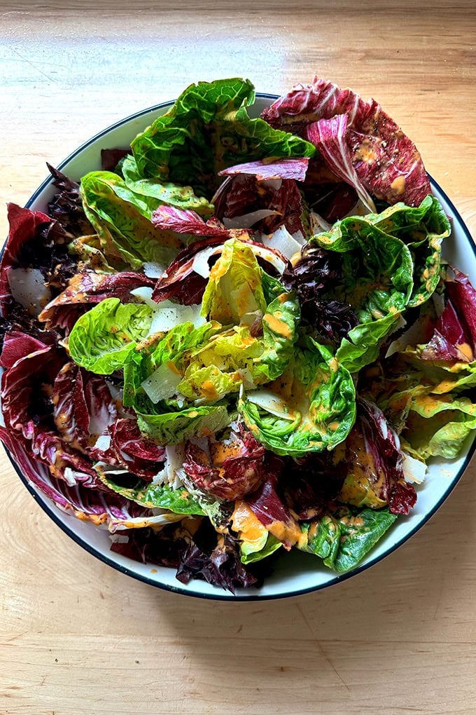 A radicchio and Little Gem salad dressed in a roasted red pepper dressing.