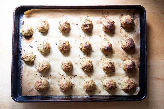 Roasted eggplant meatballs on a sheet pan.