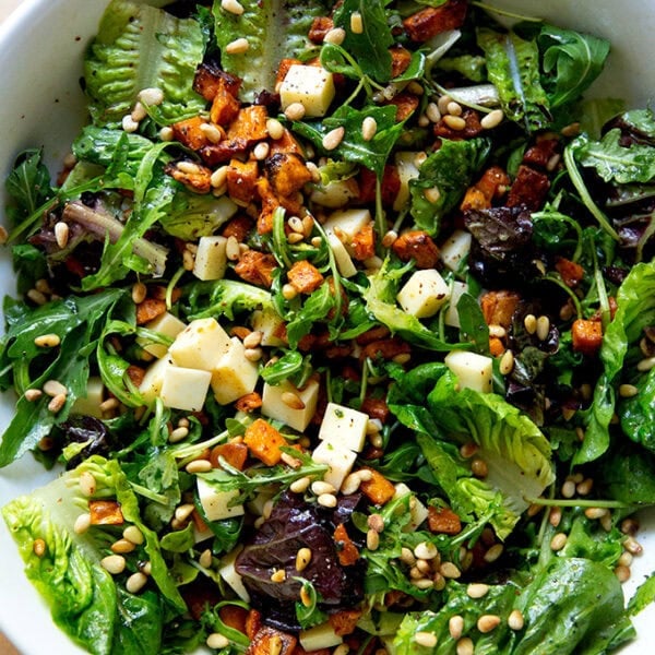 A tossed roasted sweet potato salad with greens, gruyere, toasted pine nuts and apple cider vinaigrette.