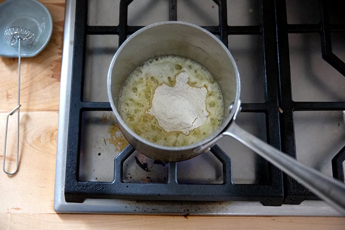 Melted butter in a small saucepan with flour added.
